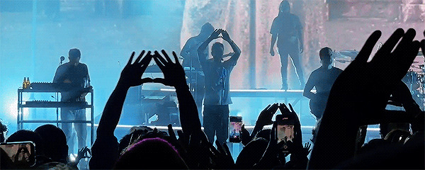 Bastille performing The Draw live in LA during BBX tour. Dan and audience are making a triangle with their hands.